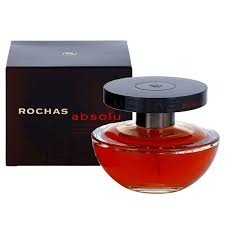 a bottle of perfume sitting next to a box